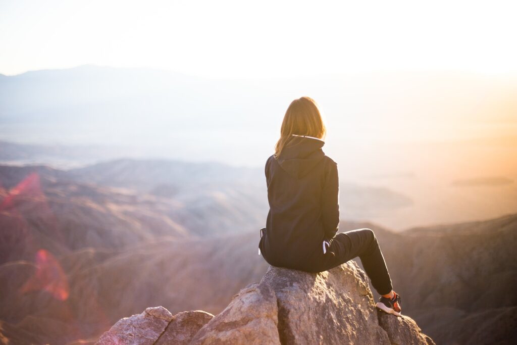 woman on the top of the hill