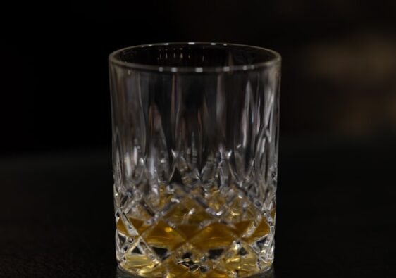 whiskey glass in dark background