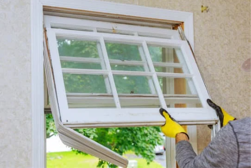 person replacing window